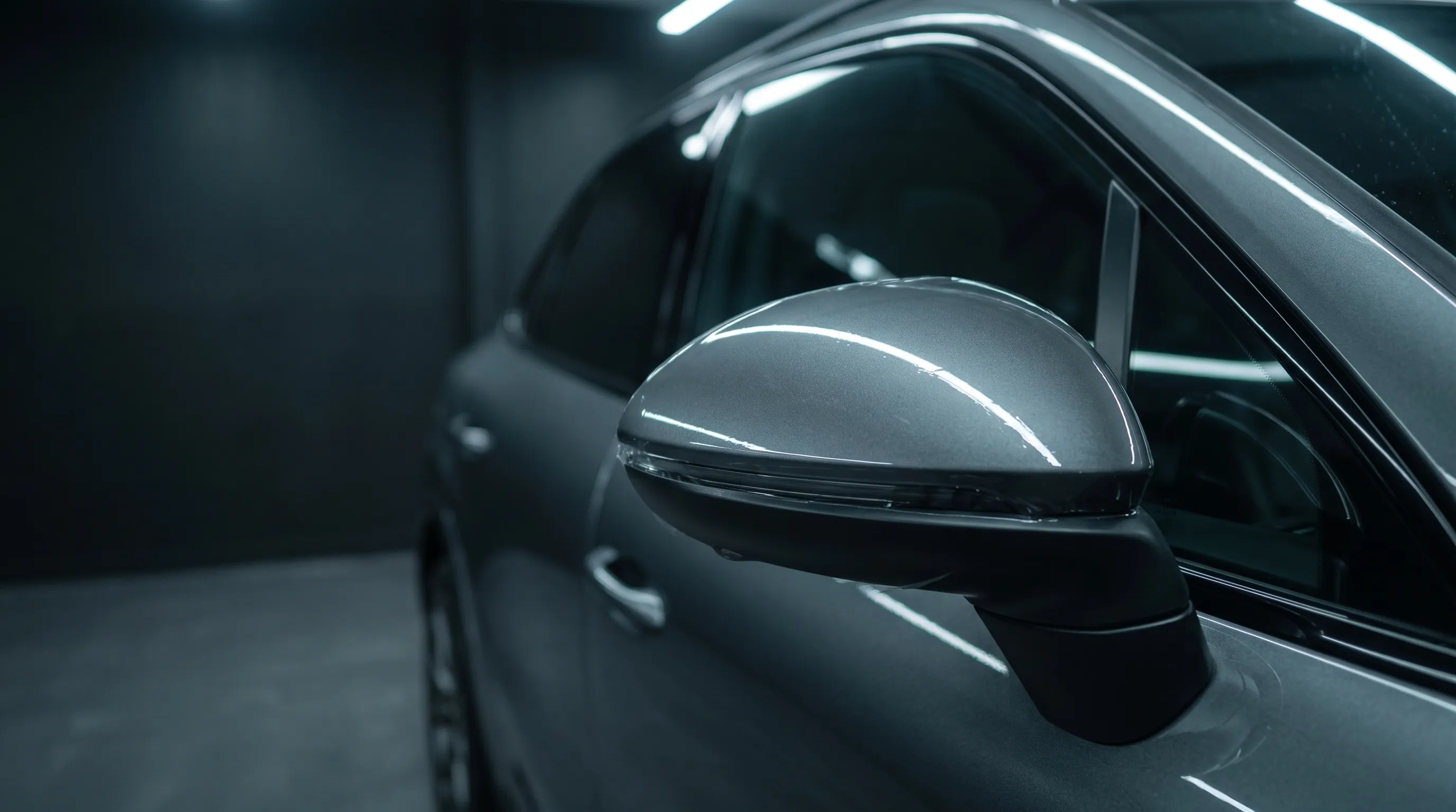 Glossy SUV side mirror cap covered with clear protective film.